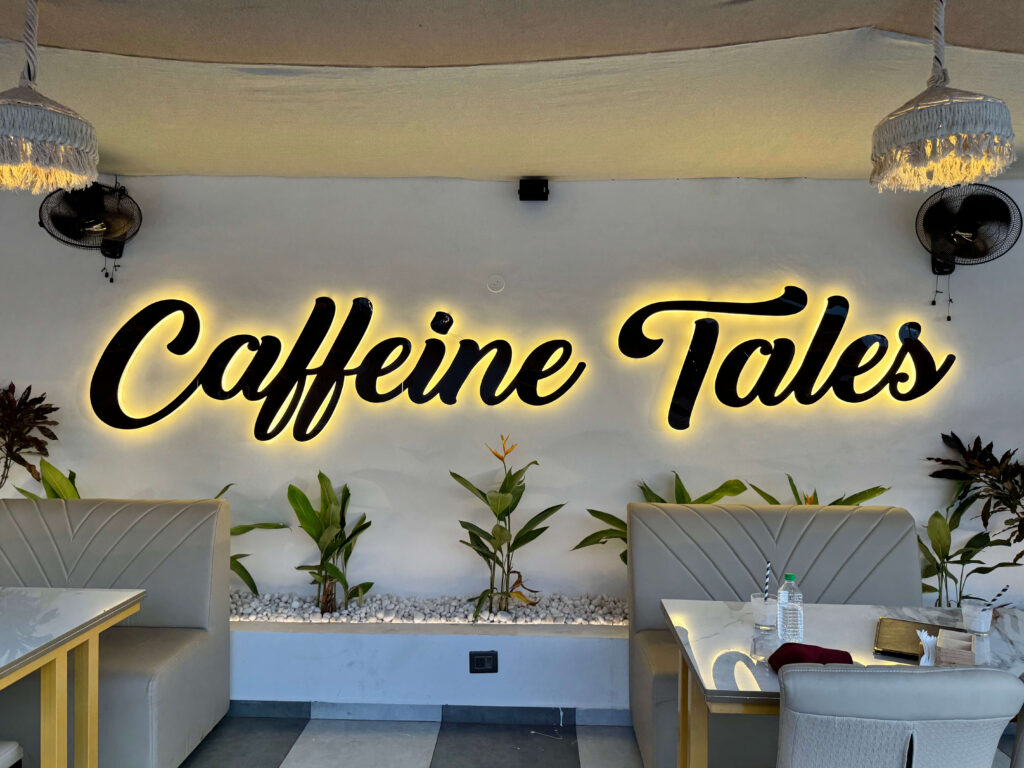 Bright and welcoming café ambience with spacious seating at Caffeine Tales