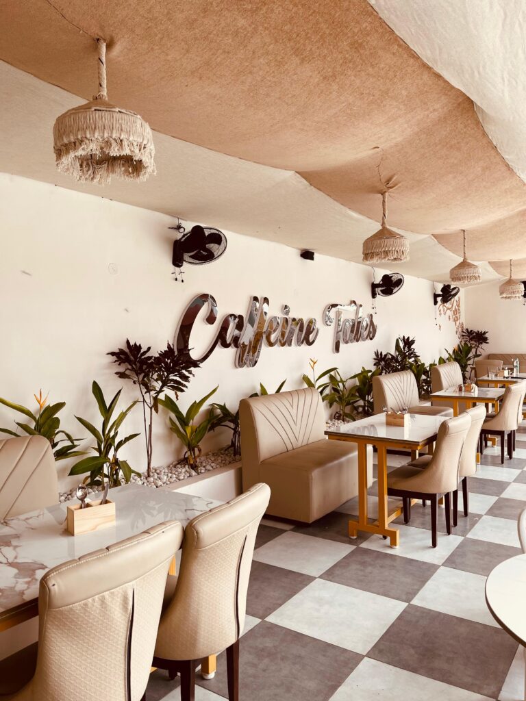 Bright and welcoming café ambience with spacious seating at Caffeine Tales