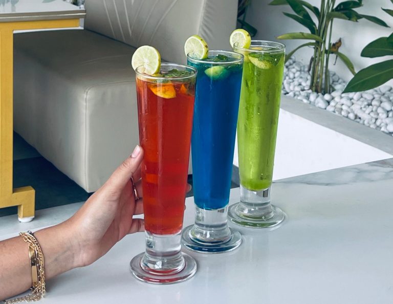 Colourful mojito drinks with lemon, mint, and ice at Caffeine Tales