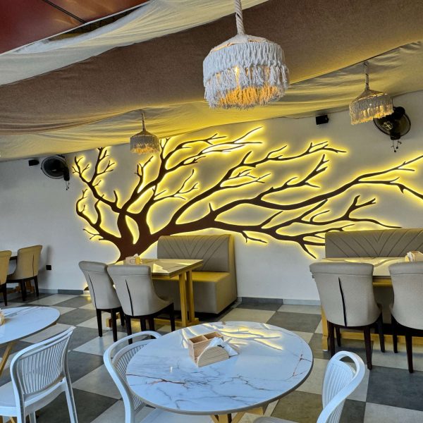 Comfortable seating space with modern decor and natural tones at Caffeine Tales