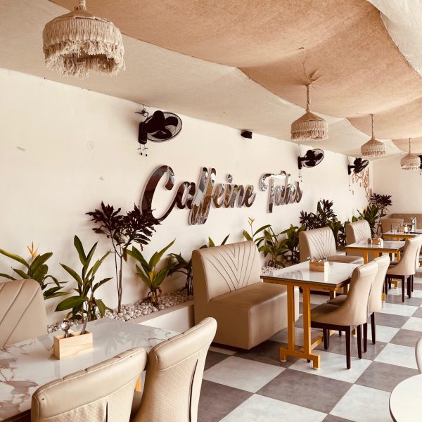 Bright and welcoming café ambience with spacious seating at Caffeine Tales